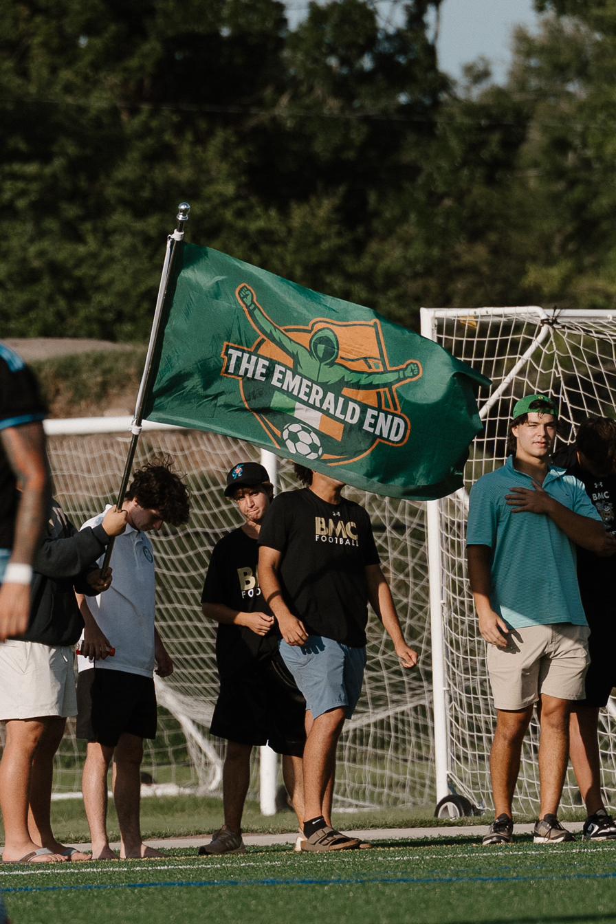 The Emerald End supporters flag behind the goal